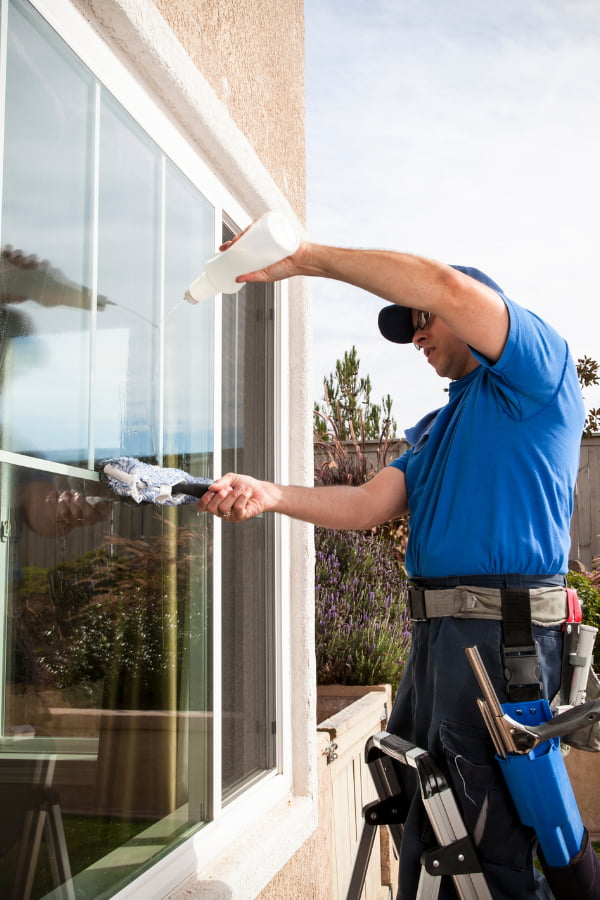 image of a man installing window film