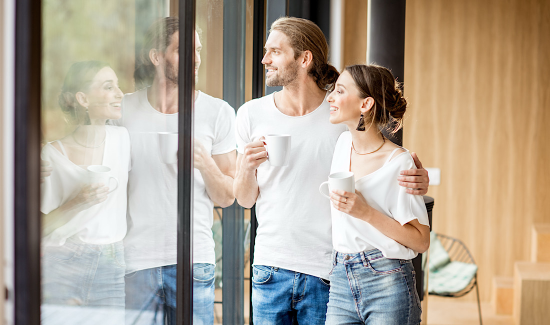 Happy couple enjoying energy savings from newly installed window tint on their home in Meridian, ID.